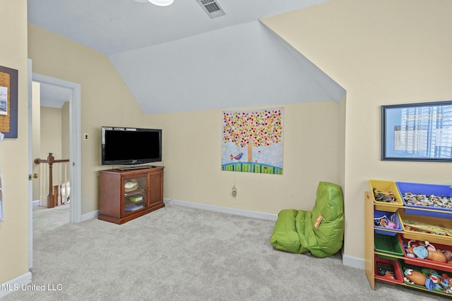 rec room featuring light carpet and lofted ceiling