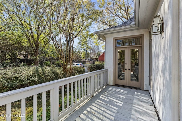 wooden deck featuring french doors