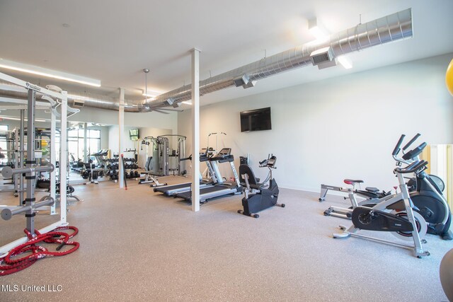 gym featuring baseboards