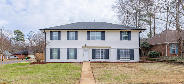 view of front of home with a front lawn