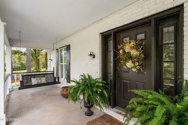 property entrance with covered porch