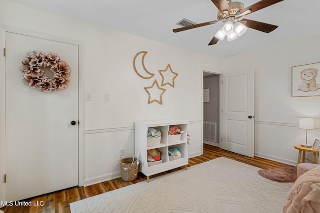 bedroom featuring hardwood / wood-style floors and ceiling fan