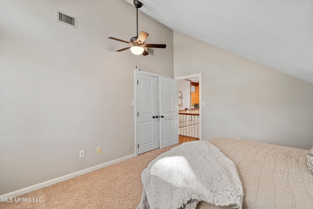 bedroom featuring ceiling fan, high vaulted ceiling, and carpet