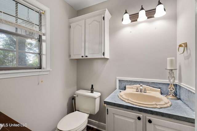 bathroom with vanity and toilet