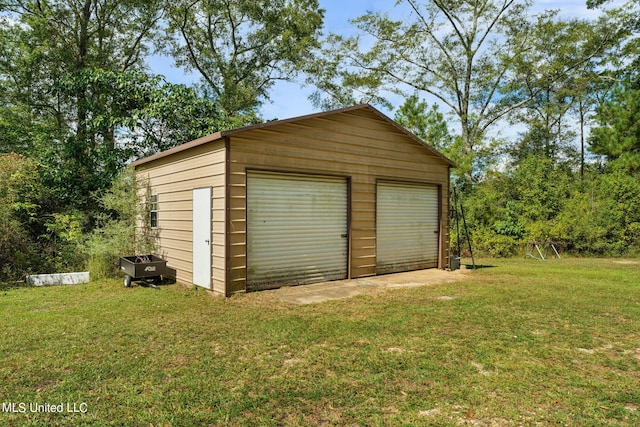 garage featuring a yard