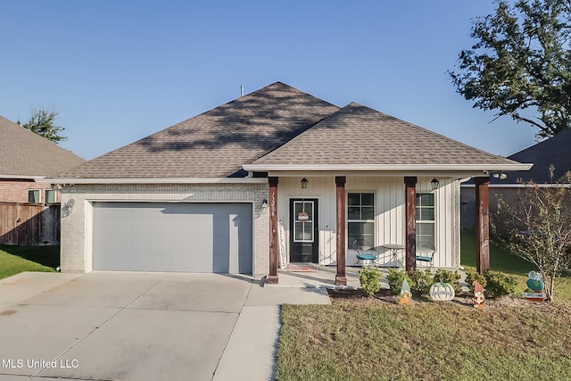 single story home featuring a front yard and a garage