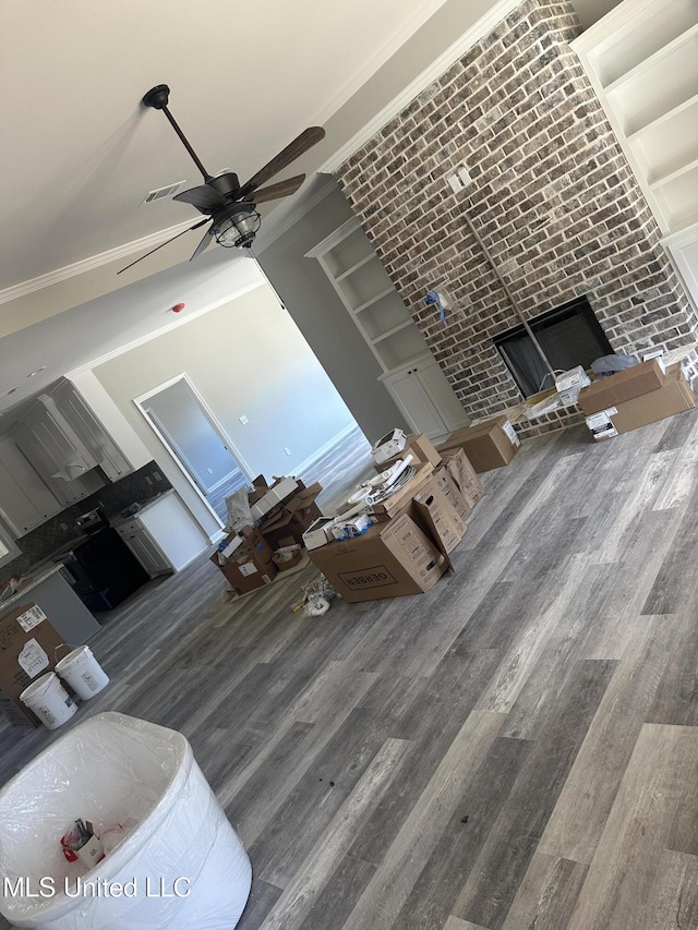 living room featuring hardwood / wood-style flooring and ceiling fan