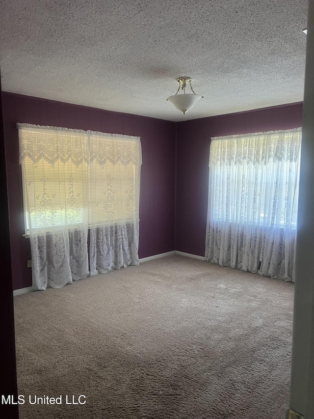 241 Iroquois St, Biloxi, MS 39530 - carpeted spare room featuring a textured ceiling