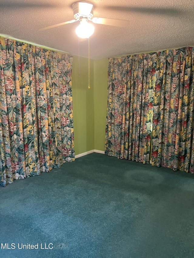 241 Iroquois St, Biloxi, MS 39530 - unfurnished room with ceiling fan, carpet floors, and a textured ceiling
