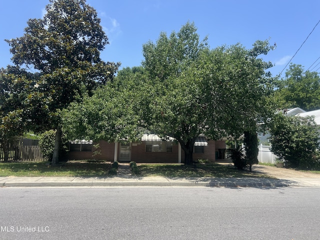 241 Iroquois St, Biloxi, MS 39530 - view of property hidden behind natural elements featuring brick siding