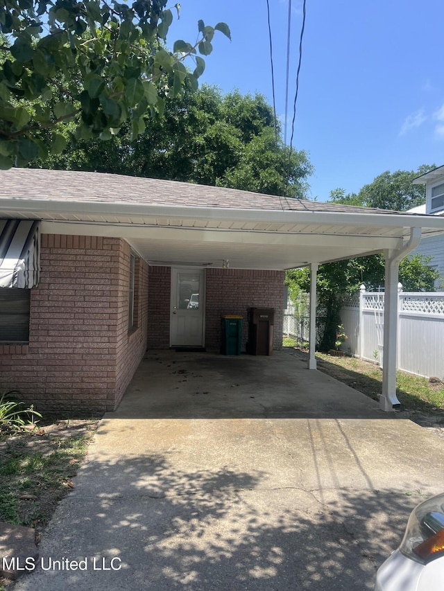 241 Iroquois St, Biloxi, MS 39530 - view of car parking with concrete driveway and an attached carport