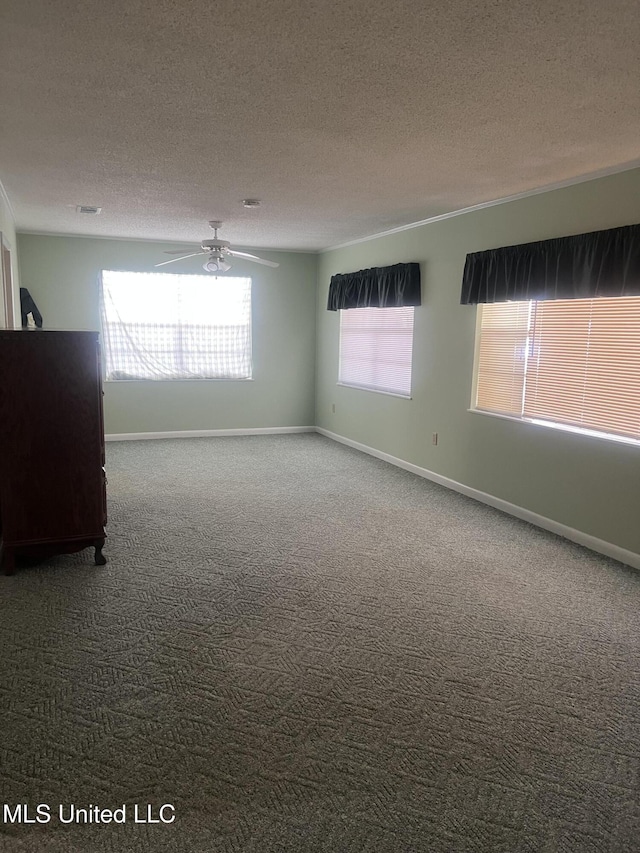 241 Iroquois St, Biloxi, MS 39530 - unfurnished room featuring a textured ceiling, ceiling fan, carpet, and baseboards