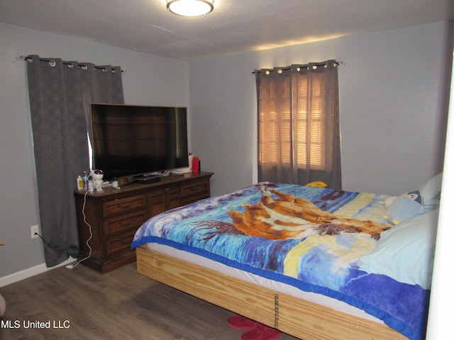 bedroom featuring dark wood-type flooring