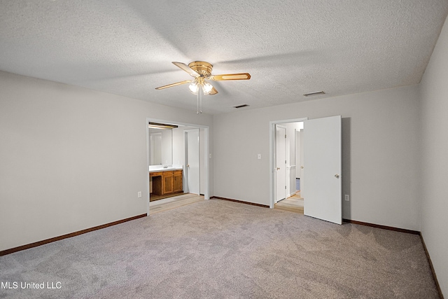 406 Springwood Cir, Terry, MS 39170 - unfurnished bedroom with light carpet, baseboards, a textured ceiling, and ceiling fan