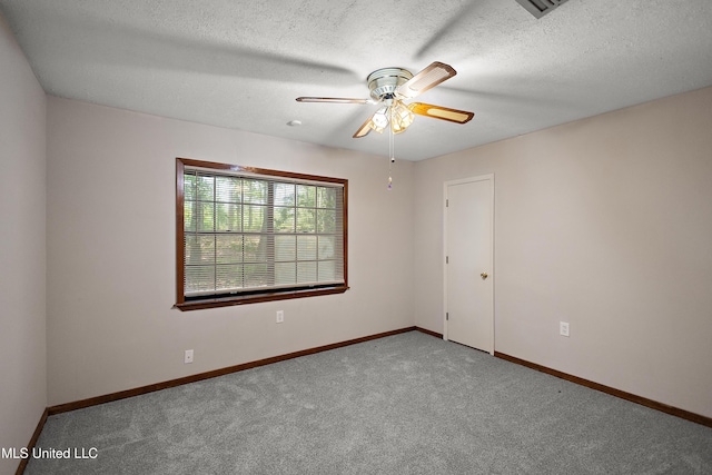 406 Springwood Cir, Terry, MS 39170 - carpeted empty room with a ceiling fan, baseboards, and a textured ceiling