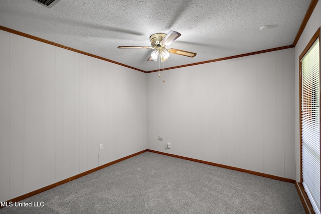 406 Springwood Cir, Terry, MS 39170 - spare room with ceiling fan, carpet floors, crown molding, and a textured ceiling