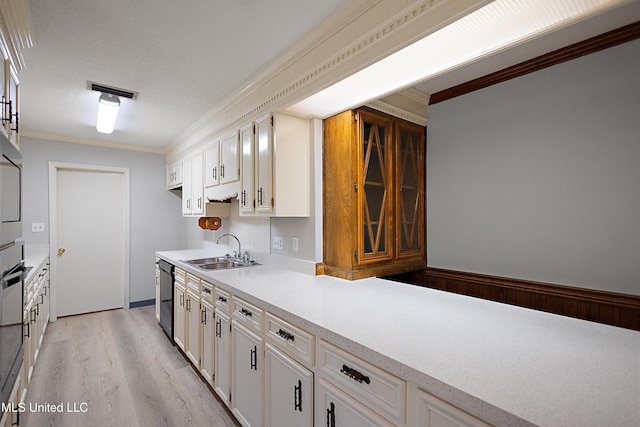 406 Springwood Cir, Terry, MS 39170 - kitchen with a sink, ornamental molding, light countertops, black dishwasher, and light wood-style floors