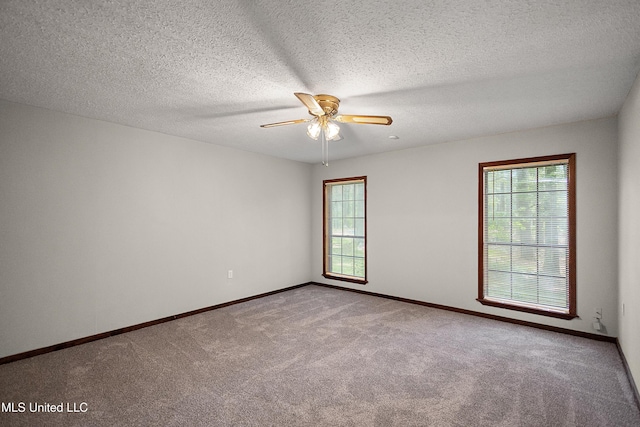 406 Springwood Cir, Terry, MS 39170 - spare room featuring a ceiling fan, carpet floors, baseboards, and a textured ceiling