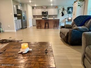 154 Magnolia Farms Dr, Lucedale, MS 39452 - living area with light wood-style floors, baseboards, and recessed lighting