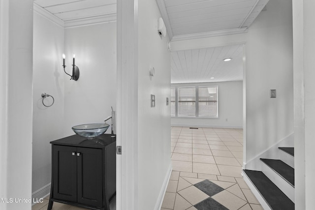 bathroom featuring ornamental molding, vanity, and tile patterned floors