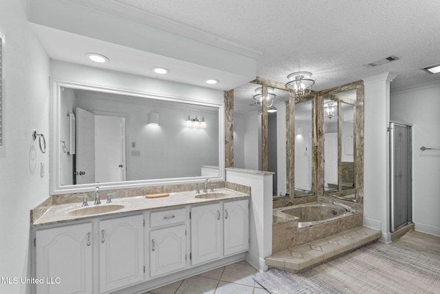 bathroom featuring a textured ceiling, tiled bath, crown molding, and tile patterned floors