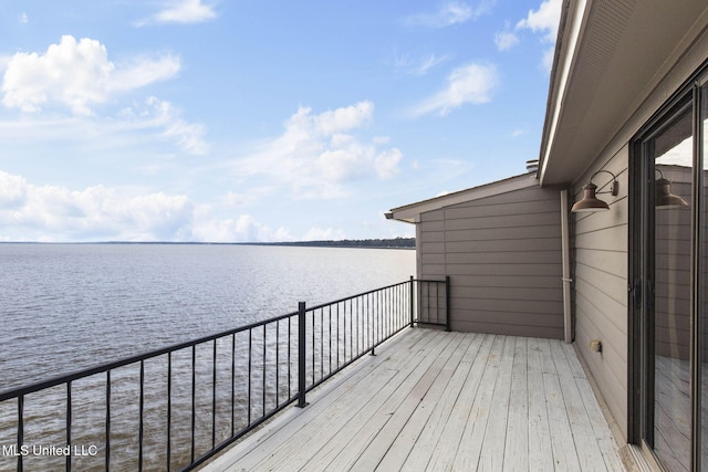 wooden deck with a water view