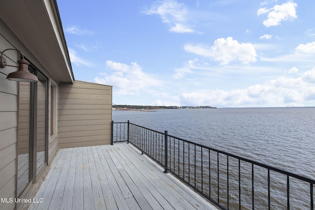 wooden deck featuring a water view