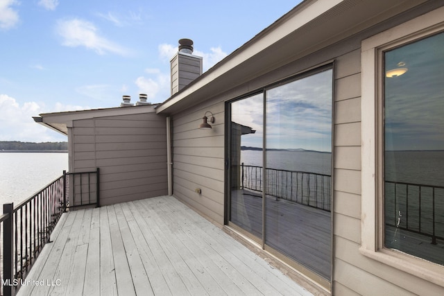 wooden terrace with a water view