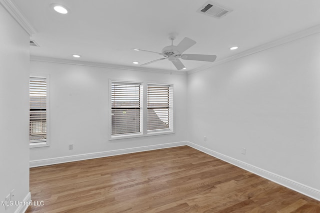 spare room featuring ornamental molding, ceiling fan, and light hardwood / wood-style floors