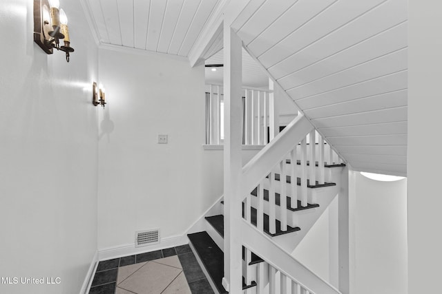 stairs featuring wooden ceiling, tile patterned flooring, and vaulted ceiling