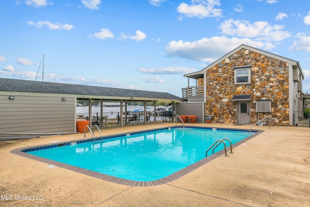 view of swimming pool featuring a patio area