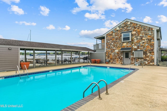 view of pool featuring a patio area