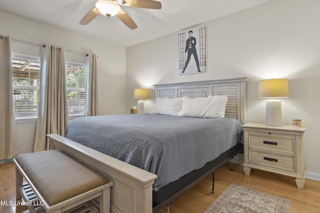 bedroom with light wood-type flooring and ceiling fan