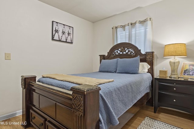 bedroom with light hardwood / wood-style flooring