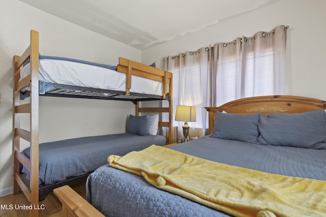 bedroom with hardwood / wood-style flooring