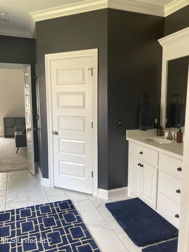 174 Falls Xing, Madison, MS 39110 - bathroom featuring marble look tiles, crown molding, baseboards, and vanity