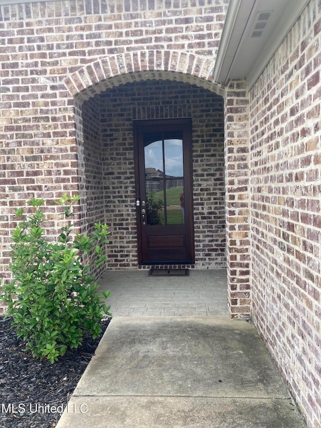 174 Falls Xing, Madison, MS 39110 - view of exterior entry with brick siding