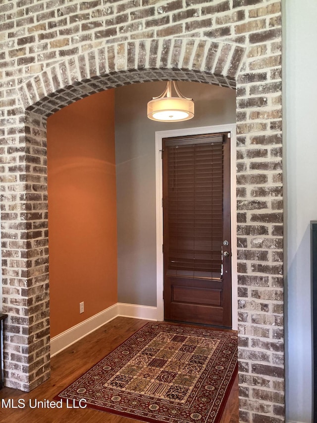 174 Falls Xing, Madison, MS 39110 - entryway with baseboards and wood finished floors
