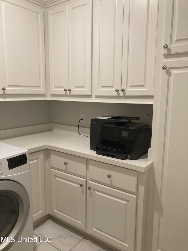 174 Falls Xing, Madison, MS 39110 - laundry room featuring washer / clothes dryer, cabinet space, and light marble finish flooring