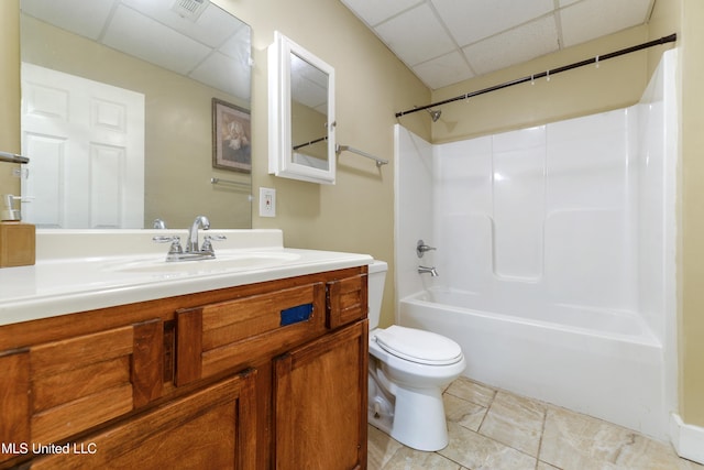 full bathroom with toilet, a paneled ceiling, tub / shower combination, vanity, and tile patterned flooring