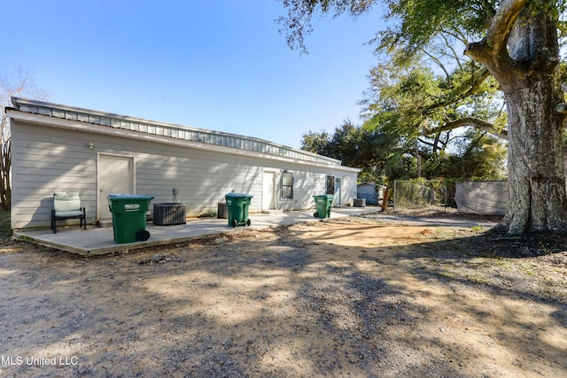 back of house with a patio and central AC