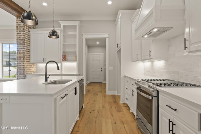 302 Wind Cv, Madison, MS 39110 - kitchen featuring appliances with stainless steel finishes, a sink, open shelves, premium range hood, and white cabinets