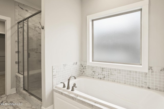 302 Wind Cv, Madison, MS 39110 - bathroom with marble finish floors, a garden tub, a shower stall, and baseboards