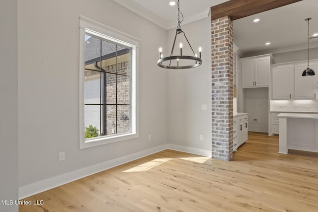 302 Wind Cv, Madison, MS 39110 - unfurnished dining area with crown molding, a chandelier, light wood finished floors, baseboards, and recessed lighting
