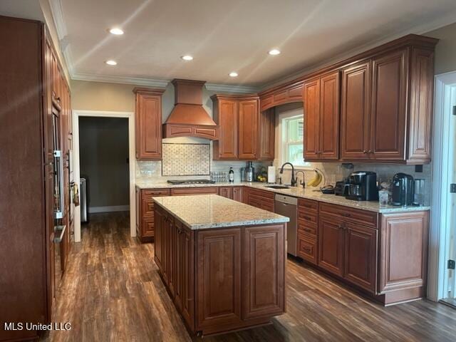 kitchen with stainless steel dishwasher, custom range hood, sink, dark hardwood / wood-style floors, and a kitchen island