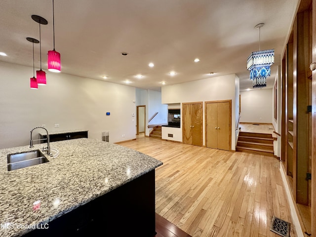 211 Monterey Dr, Clinton, MS 39056 - kitchen with a sink, light wood finished floors, recessed lighting, and pendant lighting