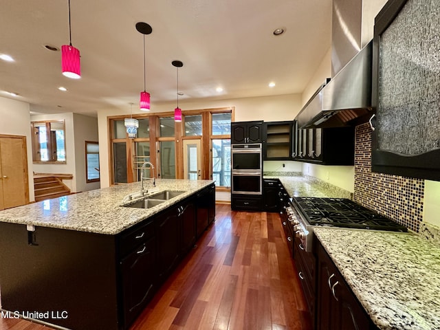211 Monterey Dr, Clinton, MS 39056 - kitchen featuring a sink, stainless steel appliances, wall chimney range hood, dark wood-style floors, and recessed lighting