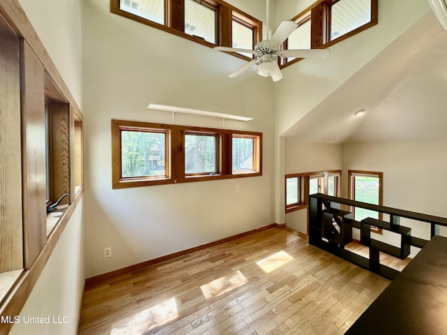 211 Monterey Dr, Clinton, MS 39056 - foyer featuring a high ceiling, ceiling fan, light wood-type flooring, and baseboards