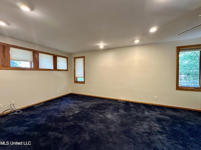 211 Monterey Dr, Clinton, MS 39056 - unfurnished room featuring baseboards, dark carpet, and recessed lighting