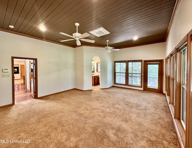 211 Monterey Dr, Clinton, MS 39056 - spare room featuring light colored carpet, wood ceiling, crown molding, arched walkways, and ceiling fan